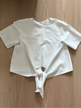 Excellent condition boutique brand White vertical striped tie-front top